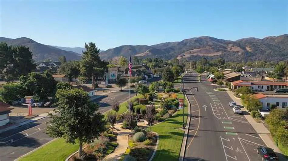 Aerial view of Buellton’s Avenue of Flags with landscaped median and mountains, service area for Plumber in Buellton.