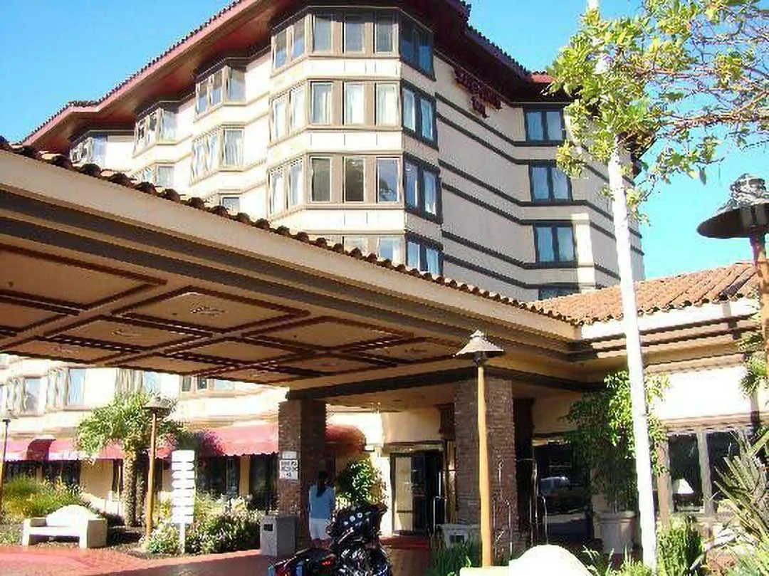 Hotel entrance with covered drive and landscaping in Santa Maria, CA, service area for Plumber in Santa Maria.