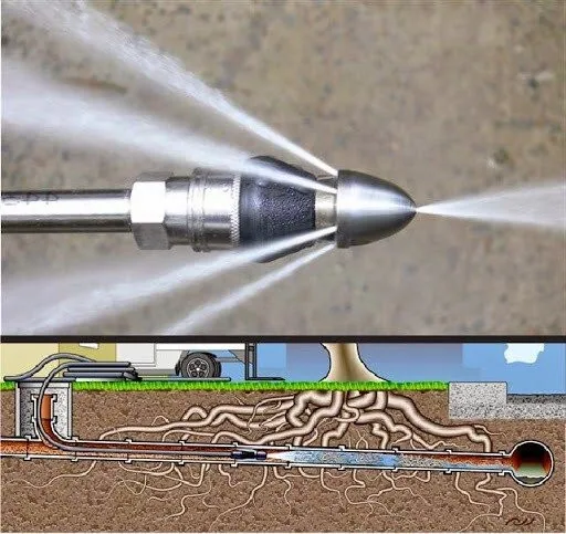 Hydro jetting nozzle spraying water inside sewer pipe in Santa Barbara, clearing tree roots and clogs underground.