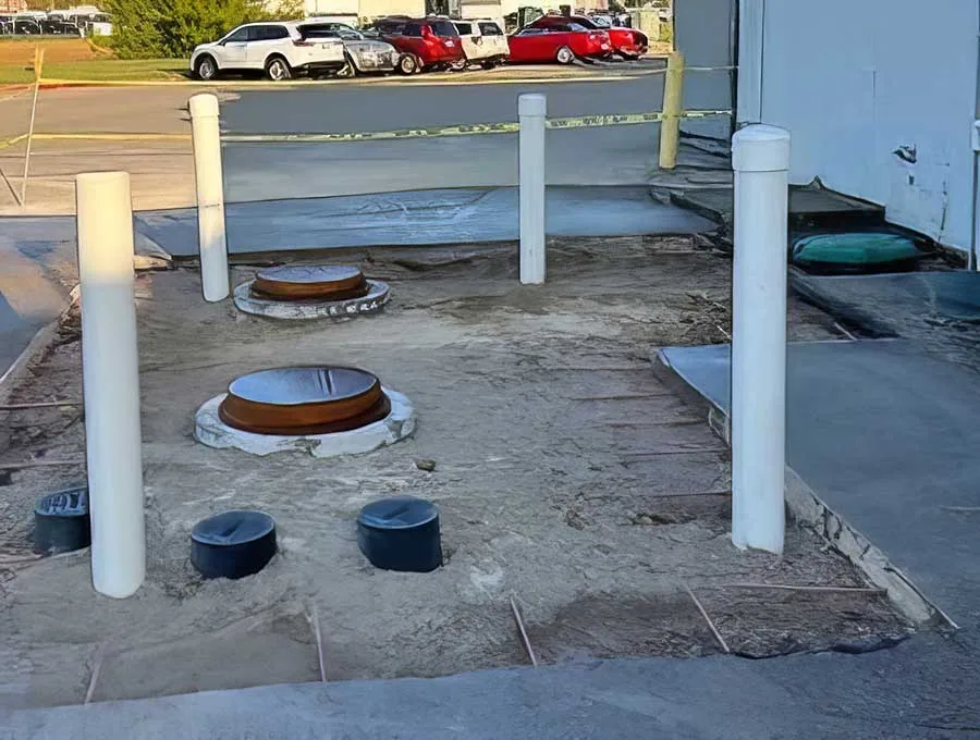 Commercial grease trap installation Santa Barbara – outdoor grease trap covers, parking lot, plumbing service for businesses.